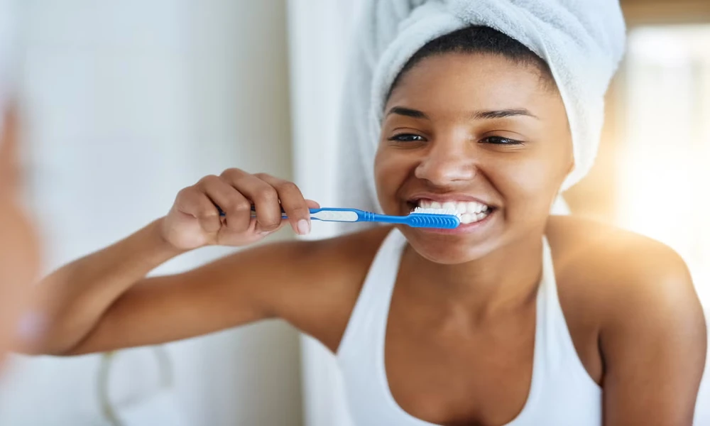 How does daily brushing protect your heart and body?